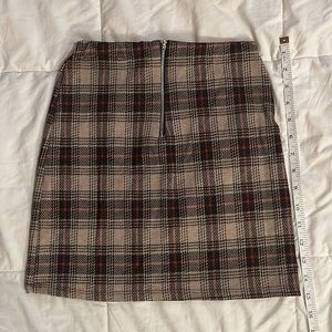 Plaid mini skirt, in good condition. Perfect for any occasion. Mid thigh length